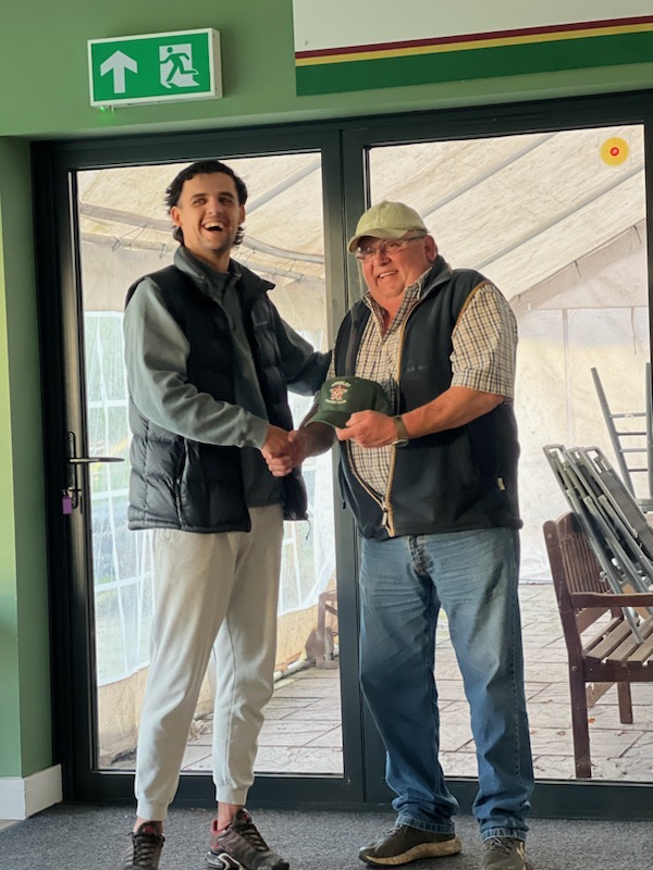 Lucas receives his Apperley CC cap from chairman Anthony Wilkes